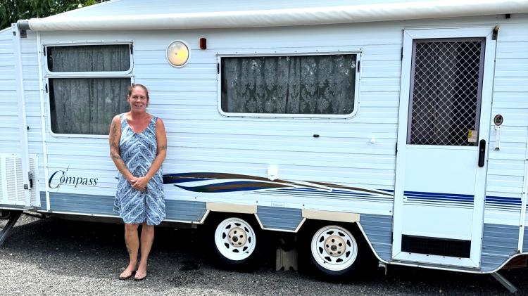 Western Downs resident Clair with her caravan before the bushfires of late 2023.