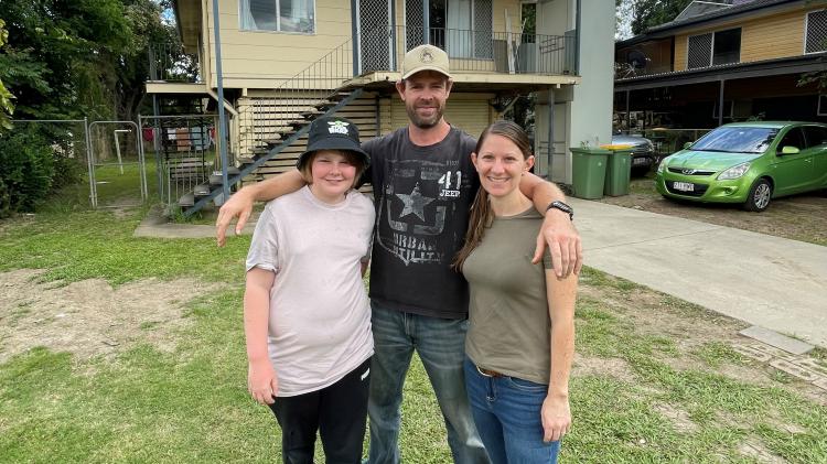 Paul, Kirsten and Jett Harding days prior to the settlement of their Enid Street home in Goodna.