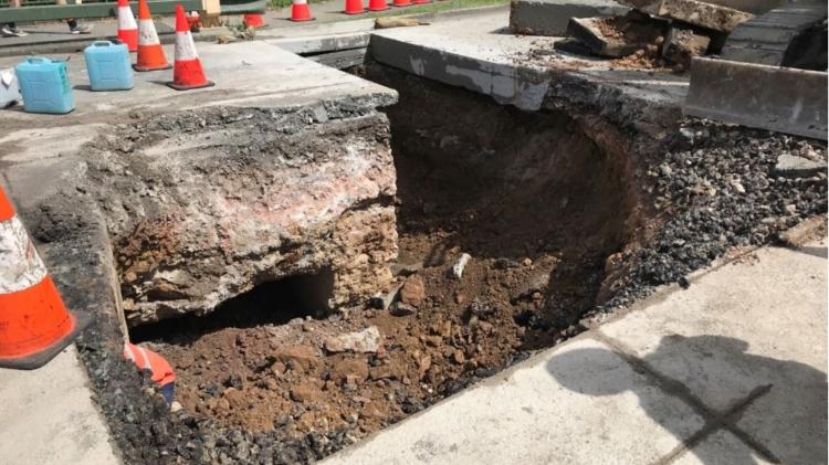 Severe erosion on Gympie Arterial Road over Downfall Creek at Chermside, Brisbane.