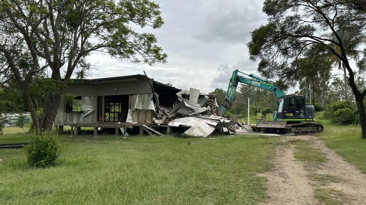 The demolition of Goodna homes bought back under the Voluntary Home Buy-Back program is a significant step in the community’s recovery.