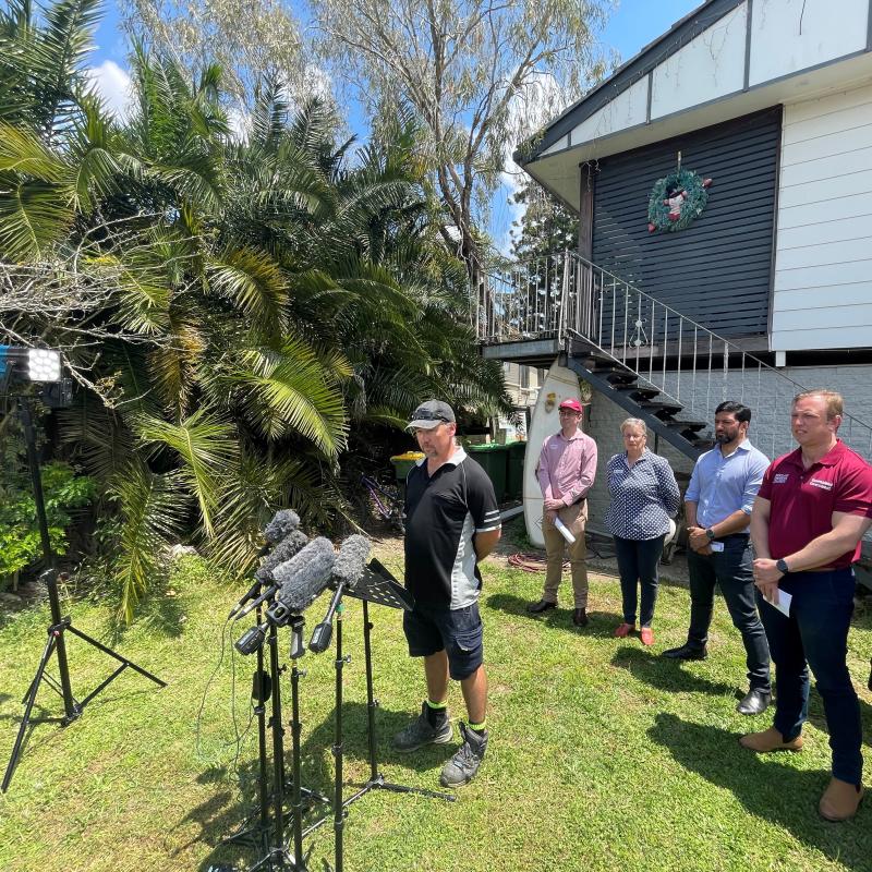 Dirk de Vos addressing media in front of his Goodna home.