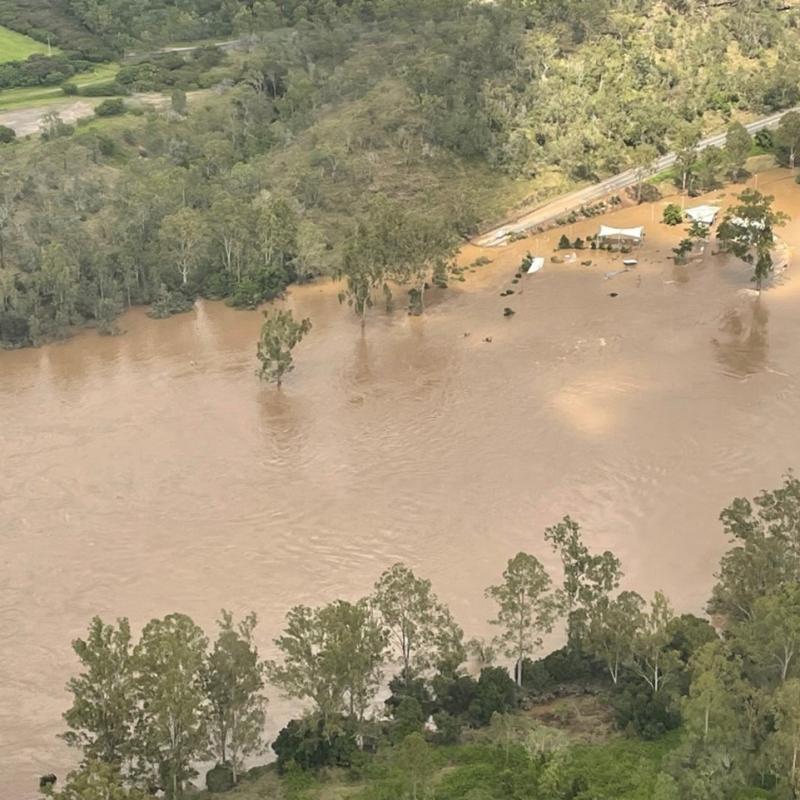 Colleges Crossing, Mount Crosby Road underwater after heavy rainfall and dam releases.