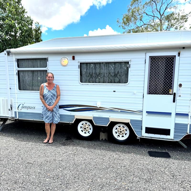 Western Downs resident Clair with her caravan before the bushfires of late 2023.