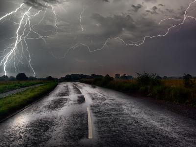 Lightning strike on flooded road